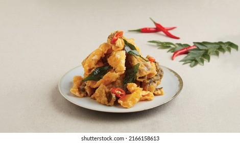 Crispy Fried Salted Egg Yolk Fish Skin Served In A Dish Isolated On Wooden Board Side View Dark Background