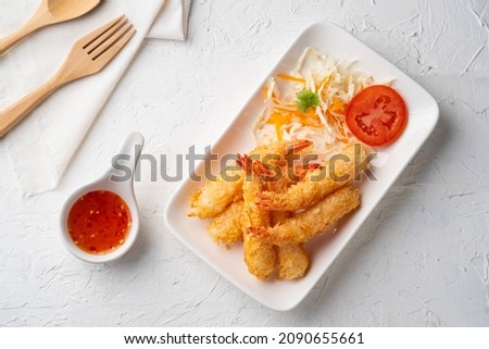 Crispy fried shrimp.Deep fry shrimp with Breadcrumbs on white plate with chilli sweet sauce.Top view