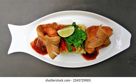 Crispy Fried Snapper just serve it with mash potatoes, some spicy soy sauce syrup and decorate with some lemon chilly broccoli vegetables. Its a continental restaurant dish