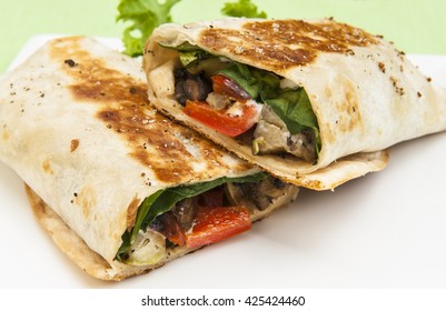 Crispy Grilled Vegetable Wrap On A White Plate