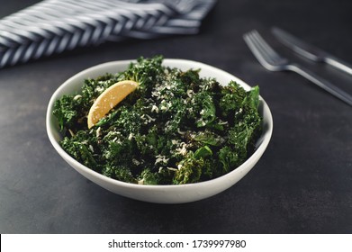 Crispy Kale Salad Cooked By Air Fryer In White Bowl On Black Table