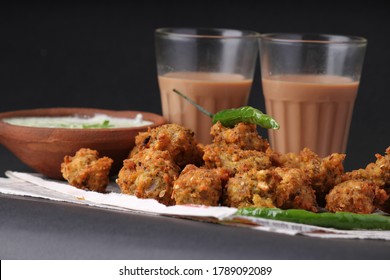 Crispy Moong Pakora, Delicious Street Food, Favourite Indian Snack In Monsoon Served With Mint Chutney And Hot Tea