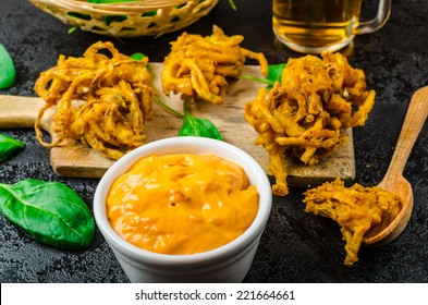 Crispy Onion Bhajis with creame cheese dip with jalapeno and crunchi toast on spinach leaves and czech beer