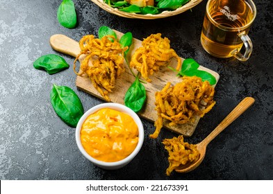 Crispy Onion Bhajis With Creame Cheese Dip With Jalapeno And Crunchi Toast On Spinach Leaves And Czech Beer