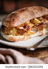 Crispy Panko Chicken Sandwich With Cheese Sauce On Plate