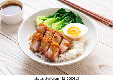 crispy pork belly on topped rice - Asian food style