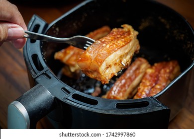 Crispy pork in oven air fryer - Shutterstock ID 1742997860