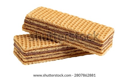 Crispy rectangular chocolate wafer biscuits stacked on top of each other