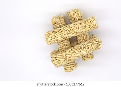 Crispy Rice Rollers Stacked Like A Hash Mark On White Background