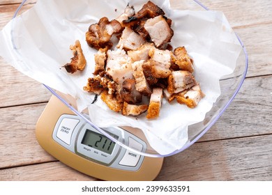 crispy roast pork, usually the fatty pork belly, in the process of weighing