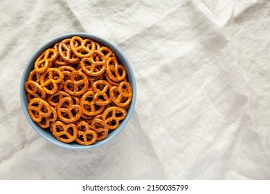 Crispy Salty Baked Pretzels in a Bowl, top view. Flat lay, overhead, from above. Space for text.