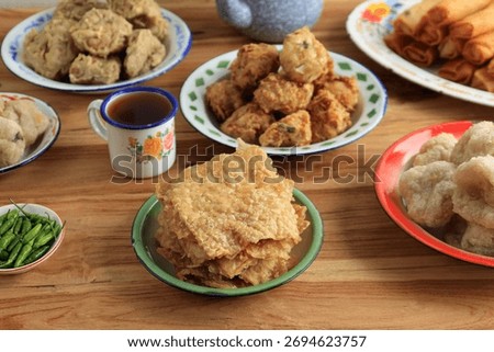 Crispy Thin SLice Fried Tempeh, Tempe Goreng Krispi, with other Various Gorengan for Breaking the Fast