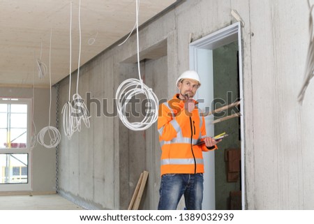 A Critical construction expert appraiser checking a constructin site