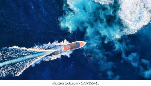 Croatia. Aerial view of luxury floating boat on blue Adriatic sea at sunny day. Fast boat on the sea surface. Seascape from drone. Travel - image
