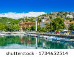 Croatia, city of Rijeka, skyline view from Delta and Rjecina river over the boats in front, colorful old buildings, monuments and Trsat on the hill in background