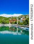 Croatia, city of Rijeka, skyline view from Delta and Rjecina river over the boats in front, colorful old buildings, monuments and Trsat on the hill in background