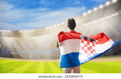 Croatia football supporter on stadium. Croatian fans cheer on soccer pitch watching winning team play. Group of supporters with flag and national jersey cheering for Croatia. Championship game victory - Powered by Shutterstock