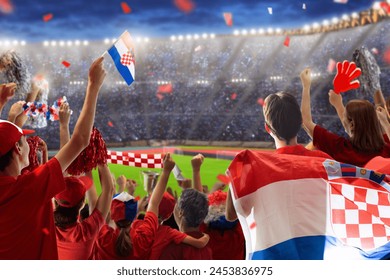 Croatia football supporter on stadium. Croatian fans cheer on soccer pitch watching winning team play. Group of supporters with flag and national jersey cheering for Croatia. Championship game victory - Powered by Shutterstock