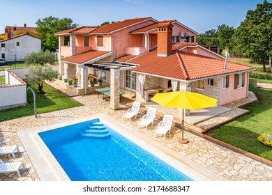 Croatia, Istria, Pula, holiday house with garden and pool, aerial view - Shutterstock ID 2174688347