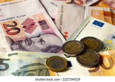 Croatia joins the eurozone.
Croatian banknotes and European banknotes (Kuna and Euro).
