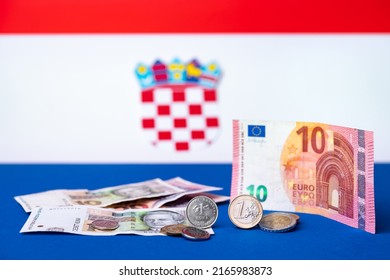 Croatian currency, kuna, together with Euro coins and 10 Euro banknote. Croatia adopted a European currency theme with the Croatian flag motif in the background.