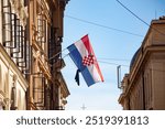 Croatian flag soaring in the skies of Zagreb