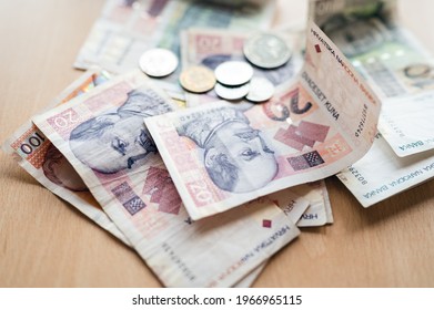 Croatian money (HRK)  in paper and coins on wooden table 