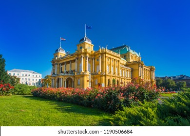 Croatian National Theater Building And Flowers In Park In Zagreb, Croatia