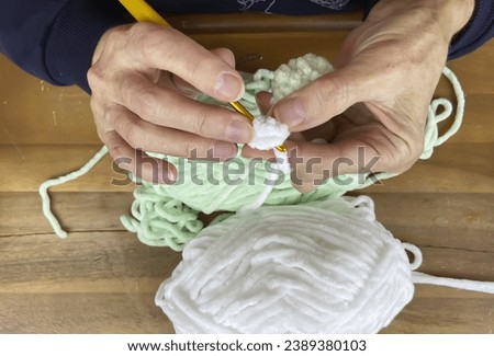 Crochet, fine knitting, close-up hands.

