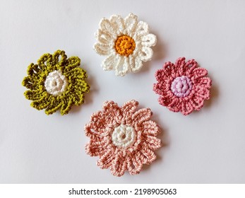 Crochet flower. Crochet of daisy flower. Crocheted flower on white background.