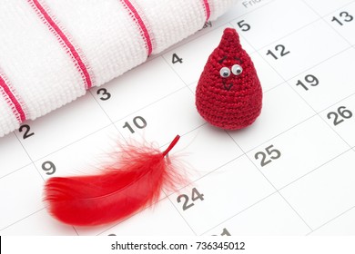 Crochet funny blood drop and a calendar. Woman critical days, gynecological menstruation cycle