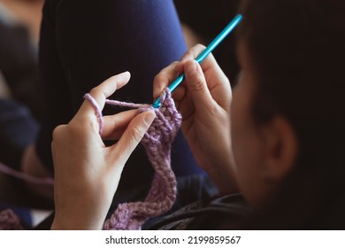 Crochet, hands knitting with wool and one needle - Powered by Shutterstock