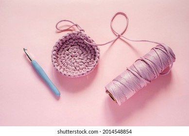 Crochet Hook And Pink Color Yarn On A Pink Background, Knitting And Crochet Supplies, Hobby And Craft