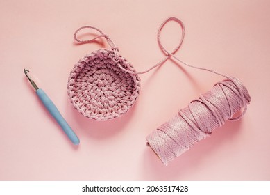 Crochet Hook And Pink Color Yarn On A Pink Background, Knitting And Crochet Supplies, Hobby And Craft