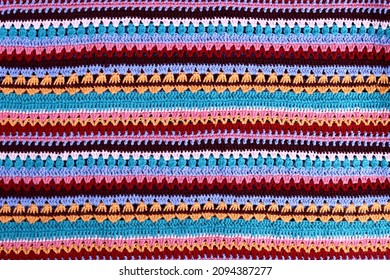 Crochet texture of colored striped knitted fabric - Shutterstock ID 2094387277