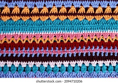 Crochet Texture Of Colored Striped Knitted Fabric