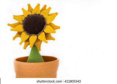a crocheted sunflower in a flowerpot