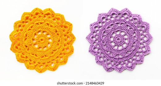 Crocheted yellow and purple lace doily close-up on a white background. Needlework, crochet. - Powered by Shutterstock