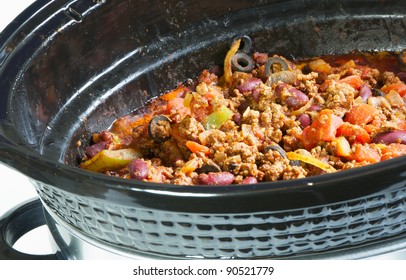 Crock Pot With Delicious Home Made Chili Simmering.