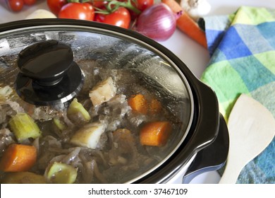 A Crock Pot Slow-cooking A Homely Beef Casserole.