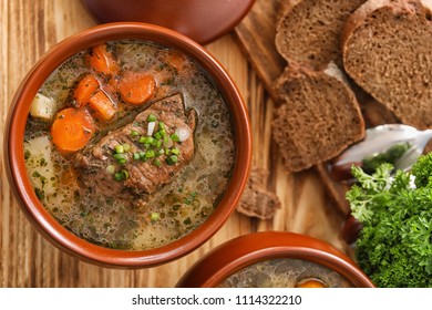 Crock Pot With Stewed Meat On Table