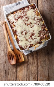 Crockpot Million Dollars Pasta With Cheese And Beef Close-up In A Baking Dish On A Table. Vertical Top View From Above
