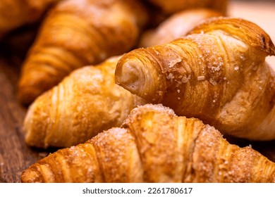 Croissant. Bakery. close-up of croissant stacked on wooden board. - Powered by Shutterstock