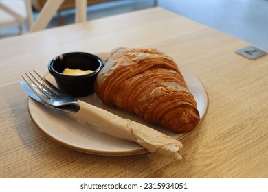 croissant at cafe on table - Shutterstock ID 2315934051