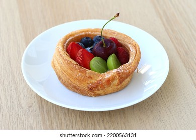 Croissant Fruit Cake Served On Plate Placed On Wooden Table