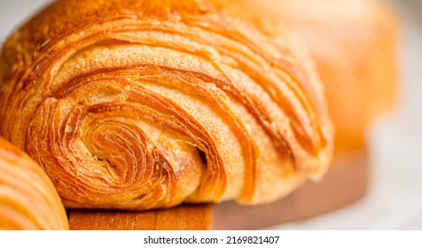 Croissant macro. French croissant with waves. Air baking. Croissant for puff pastry advertising. Croissant for a magazine.French breakfast with pastries. From puff pastry. Bun from France. Roll macro - Powered by Shutterstock