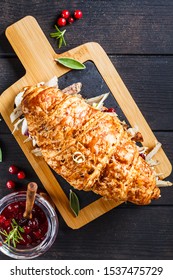 Croissant Sandwich With Duck Meat, Cream Cheese And Cranberry Sauce On Board, Dark Background.