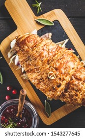 Croissant Sandwich With Duck Meat, Cream Cheese And Cranberry Sauce On Board, Dark Background.