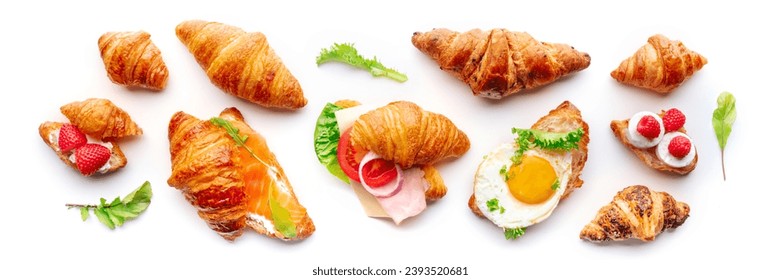 Croissant sandwich variety panorama. Different stuffed croissants, overhead flat lay shot on a white background. Rolls filled with ham, salmon, egg, etc