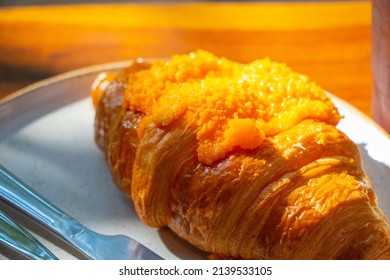 Croissant Served With Salted Egg Sauce